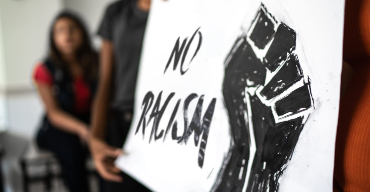 Students doing a presentation about racism